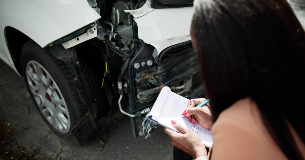 A Lawyer Taking Notes After A Truck Accident In Riverside, CA